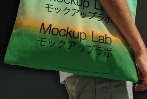 Close-up of a colorful tote bag with text Mockup Lab in English and Japanese. Ideal for showcasing graphic design projects, mockup templates.