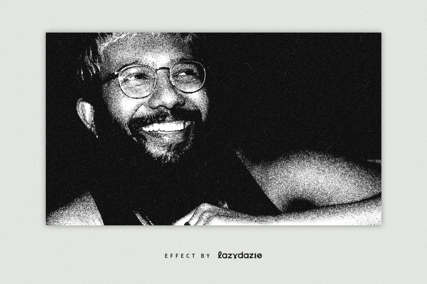 Black and white grainy portrait photo effect showing a smiling person in glasses. Perfect for graphic designers seeking unique photo filter templates.