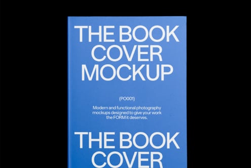 Blue book cover mockup on black background with bold white text. Ideal for showcasing design projects. Keywords: book cover, mockup, design, template.
