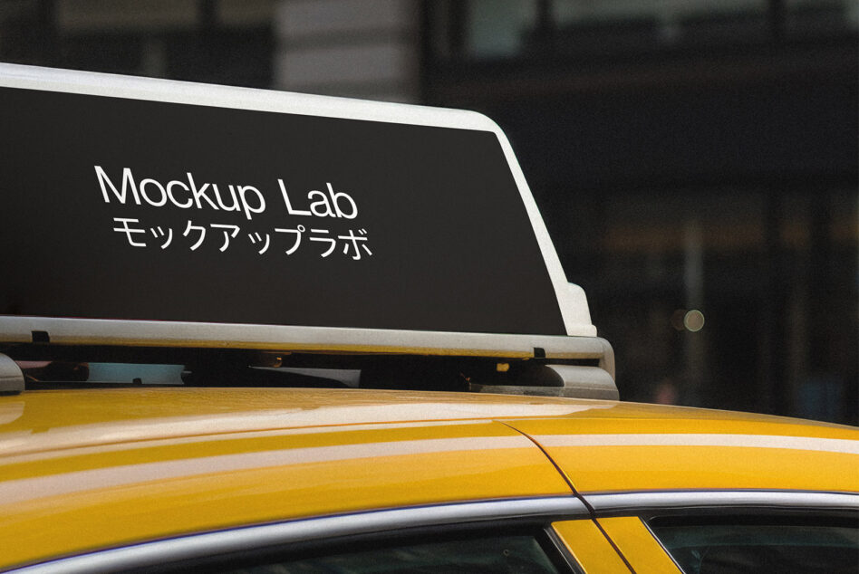 Yellow taxi roof with white trim displaying black vinyl decal text