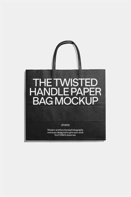 Black paper bag with twisted rope handles on neutral background, front view