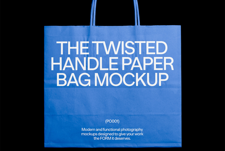 Bright blue paper tote bag with white text on dark background