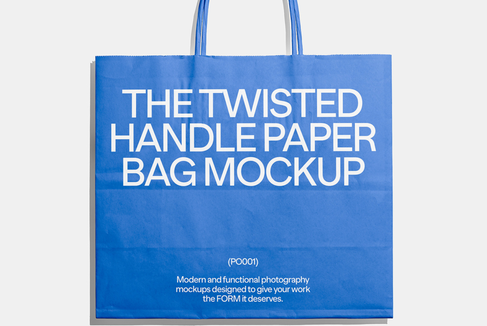 Blue tote bag mockup with shadow on light gray background