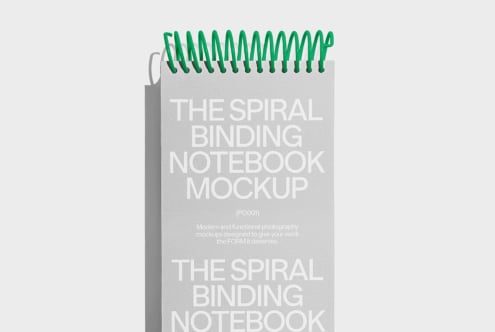 Spiral binding notebook mockup with green coils on gray background ideal for designers creating realistic stationery presentations and graphic design projects
