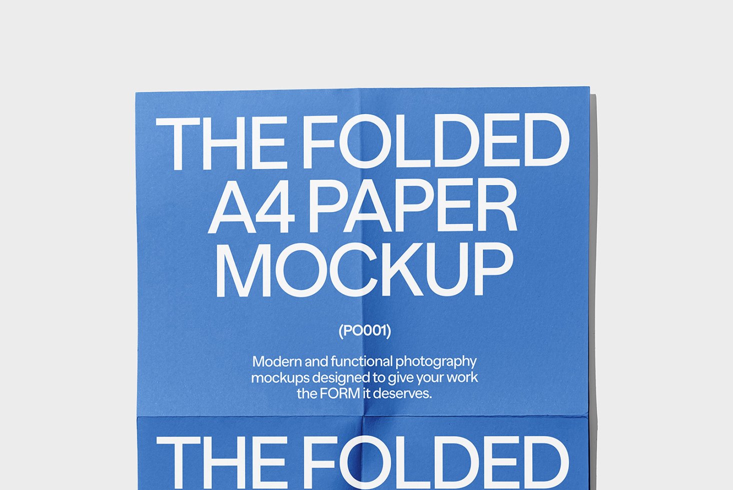 Folded A4 paper mockup in blue with white text used for modern design presentations and marketing. Ideal for designers seeking professional mockups.