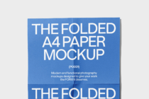 Blue folded A4 paper with subtle shadow on light gray surface