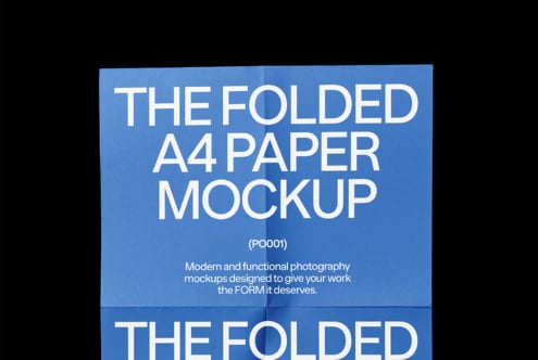 Folded A4 paper mockup in blue background. Detailed text overlay. Perfect for graphic designers and mockup templates. Ideal for showcasing designs.