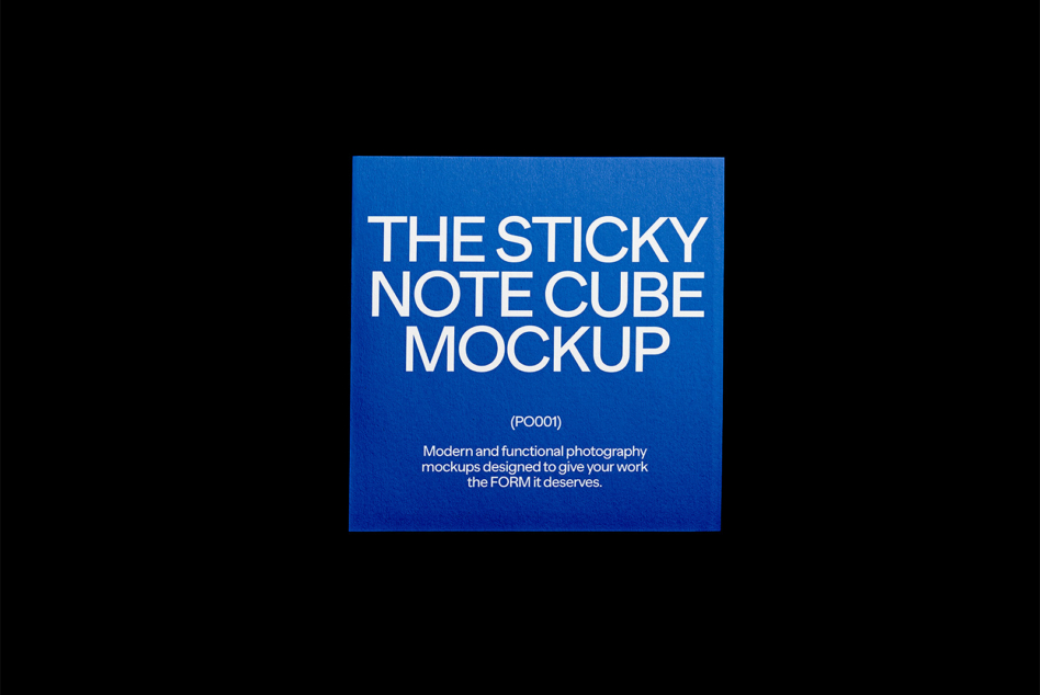 Bright blue sticky note cube on black background display