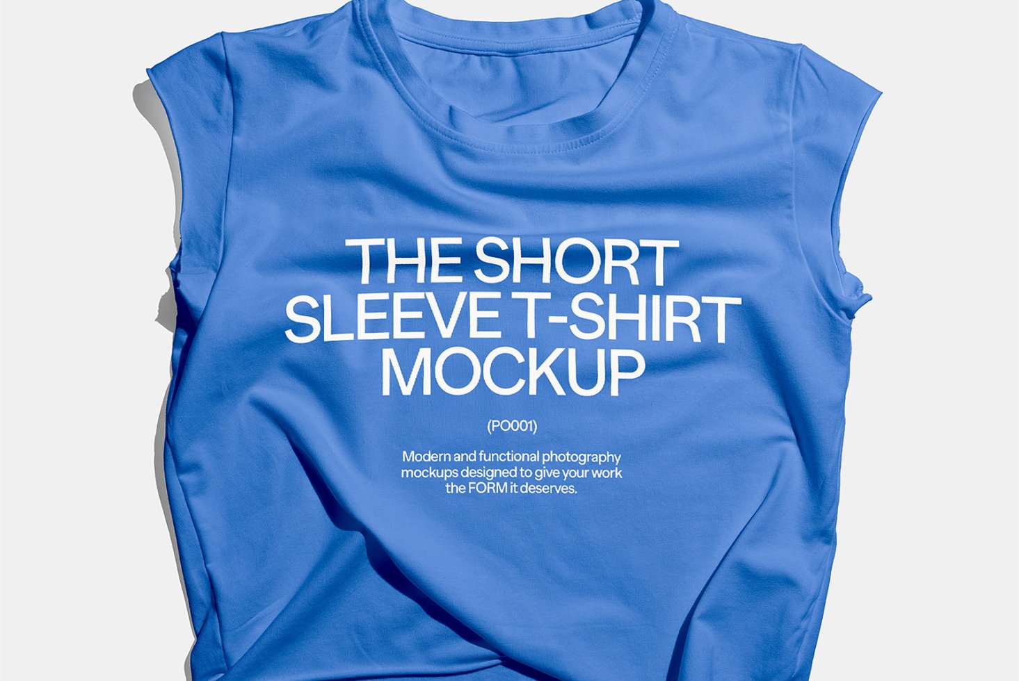 Blue short sleeve t-shirt mockup displayed on flat surface. Ideal for showcasing designs. High-quality apparel template for graphic designers.