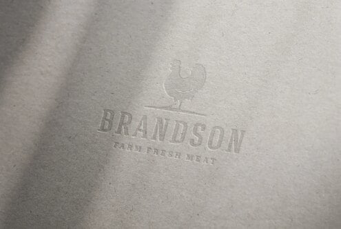 Embossed paper logo mockup with chicken illustration ideal for branding farm fresh meat businesses perfect for design presentations and marketing.