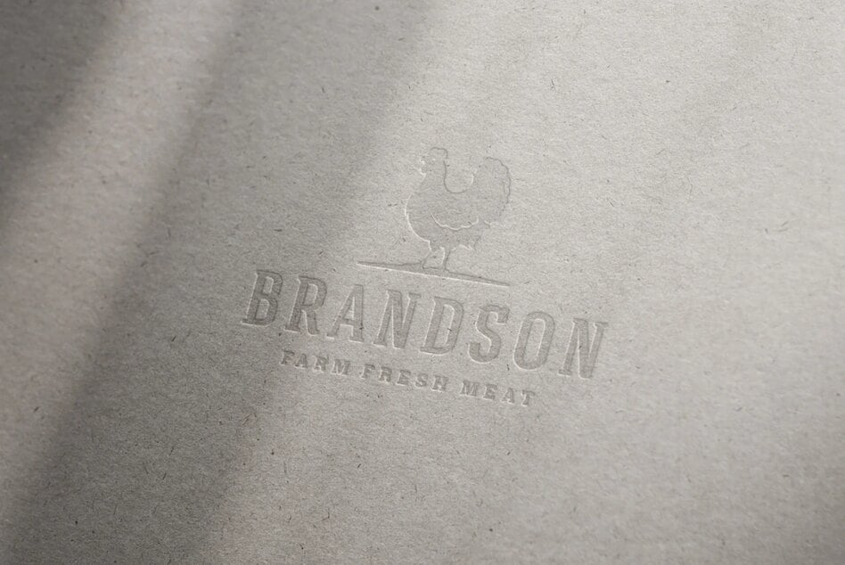 Embossed paper logo mockup with chicken illustration ideal for branding farm fresh meat businesses perfect for design presentations and marketing.