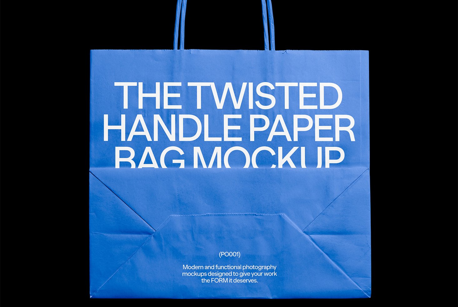 Blue paper bag mockup with twisted handles featuring bold white text. Ideal for packaging design, product display, and branding mockup templates.