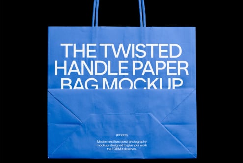 Blue paper bag mockup with twisted handles featuring bold white text. Ideal for packaging design, product display, and branding mockup templates.
