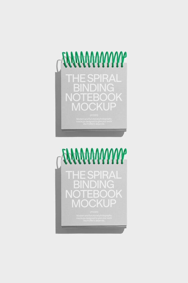 Spiral binding notebook mockup featuring green coils on gray cover ideal for graphic design presentations and template showcases for designers