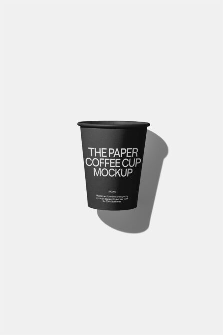 Minimalistic black paper coffee cup mockup on white background for designers. High-quality template ideal for branding and packaging presentations.
