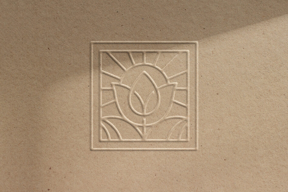 Sun leaf motif carved in square frame with border on cream background