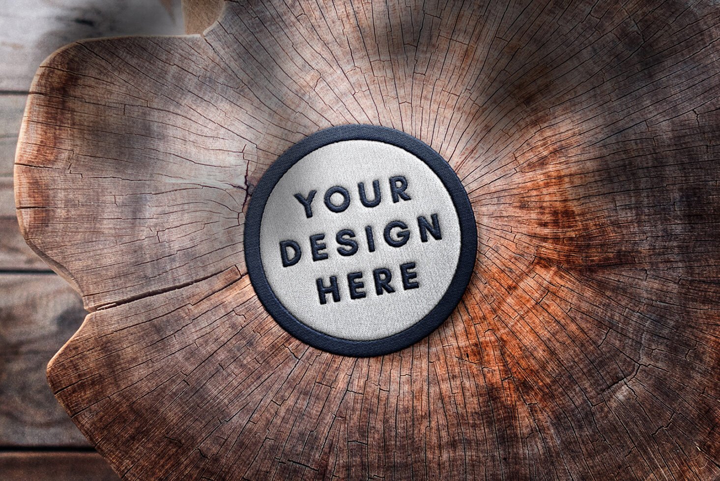 Round embroidery patch mockup on a wooden surface template for designers showcasing textured logo branding or textile graphics realistic presentation