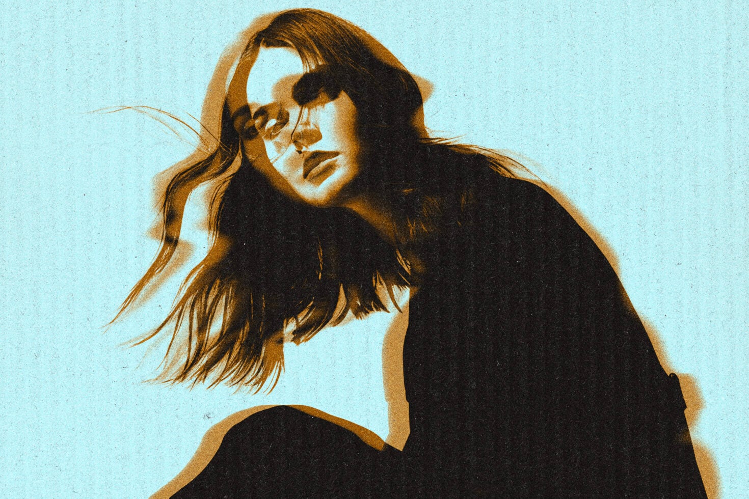 Long hair portrait with sepia duotone on light blue background