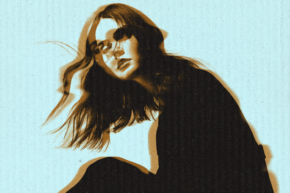 Long hair portrait with sepia duotone on light blue background