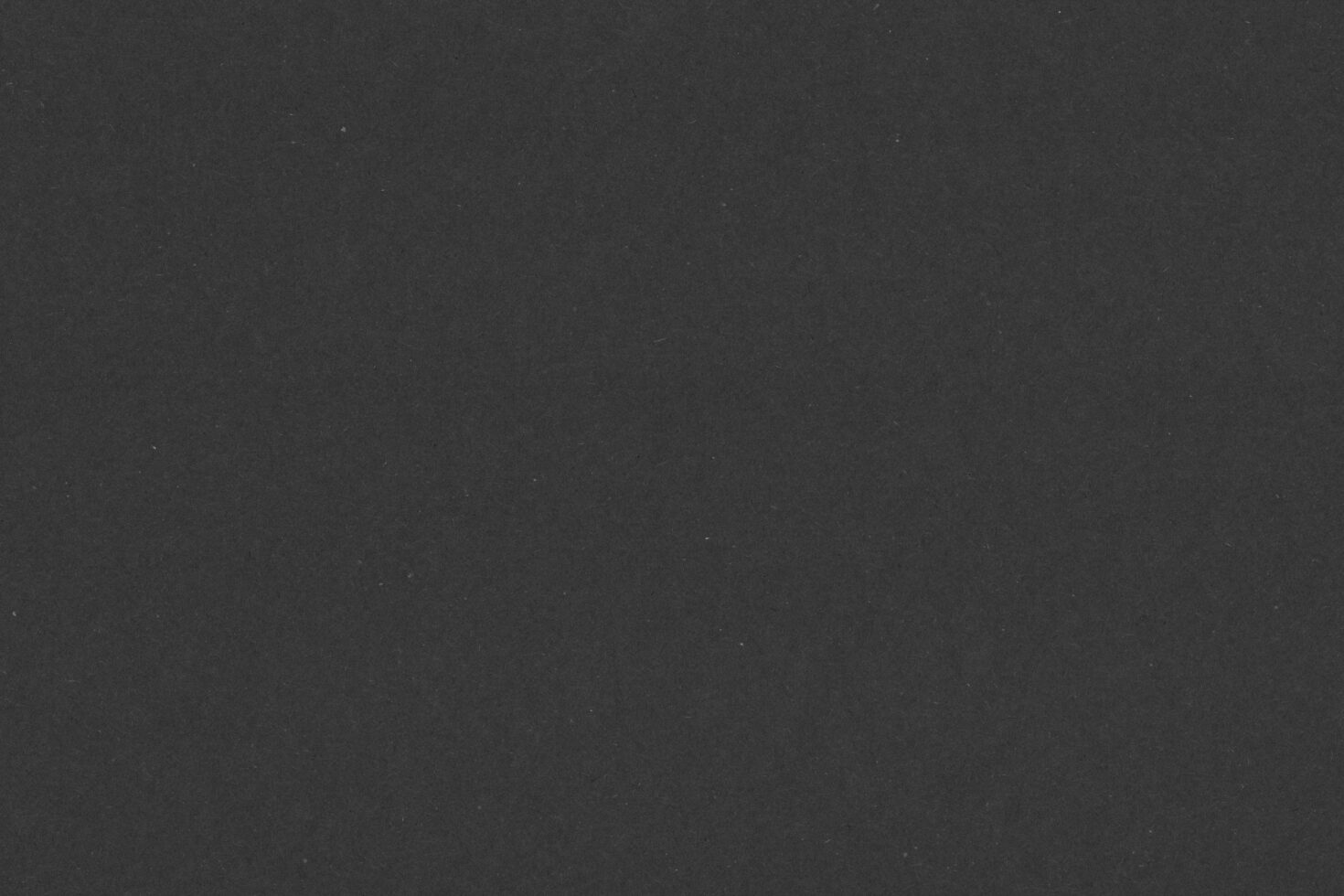 Dark textured paper background ideal for graphic designers. Perfect for mockups, templates, or graphics. High-resolution and versatile use.