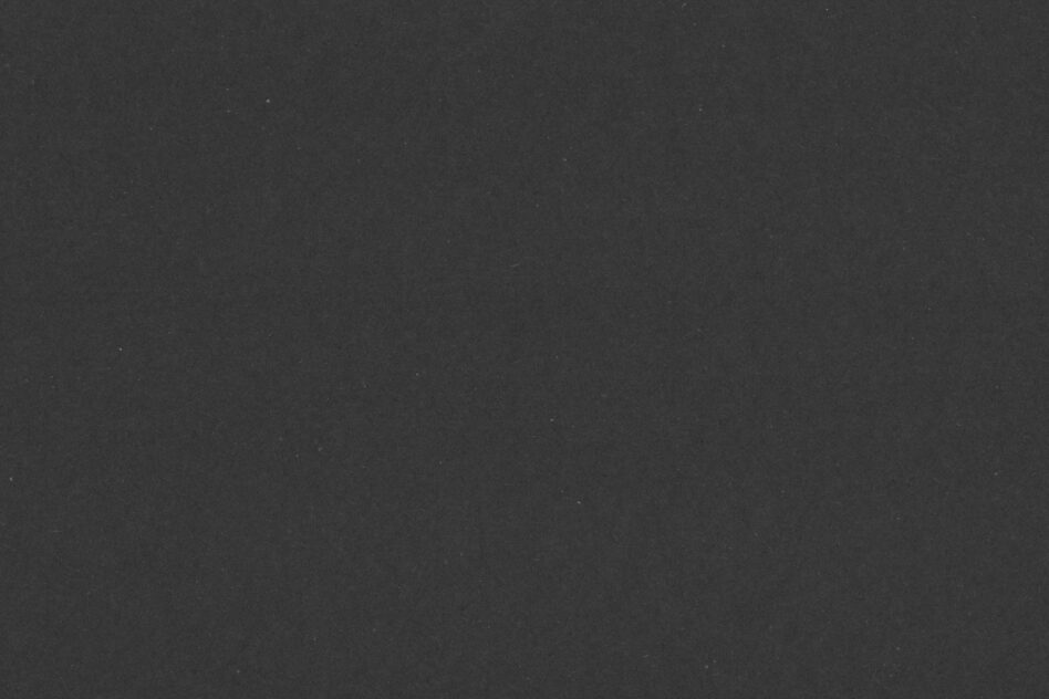 Dark textured background with subtle grain, neutral charcoal surface
