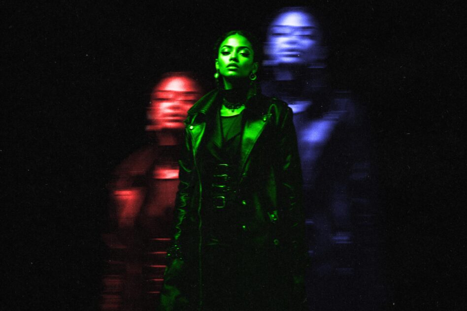 Woman in green coat surrounded by motion blurred red blue light