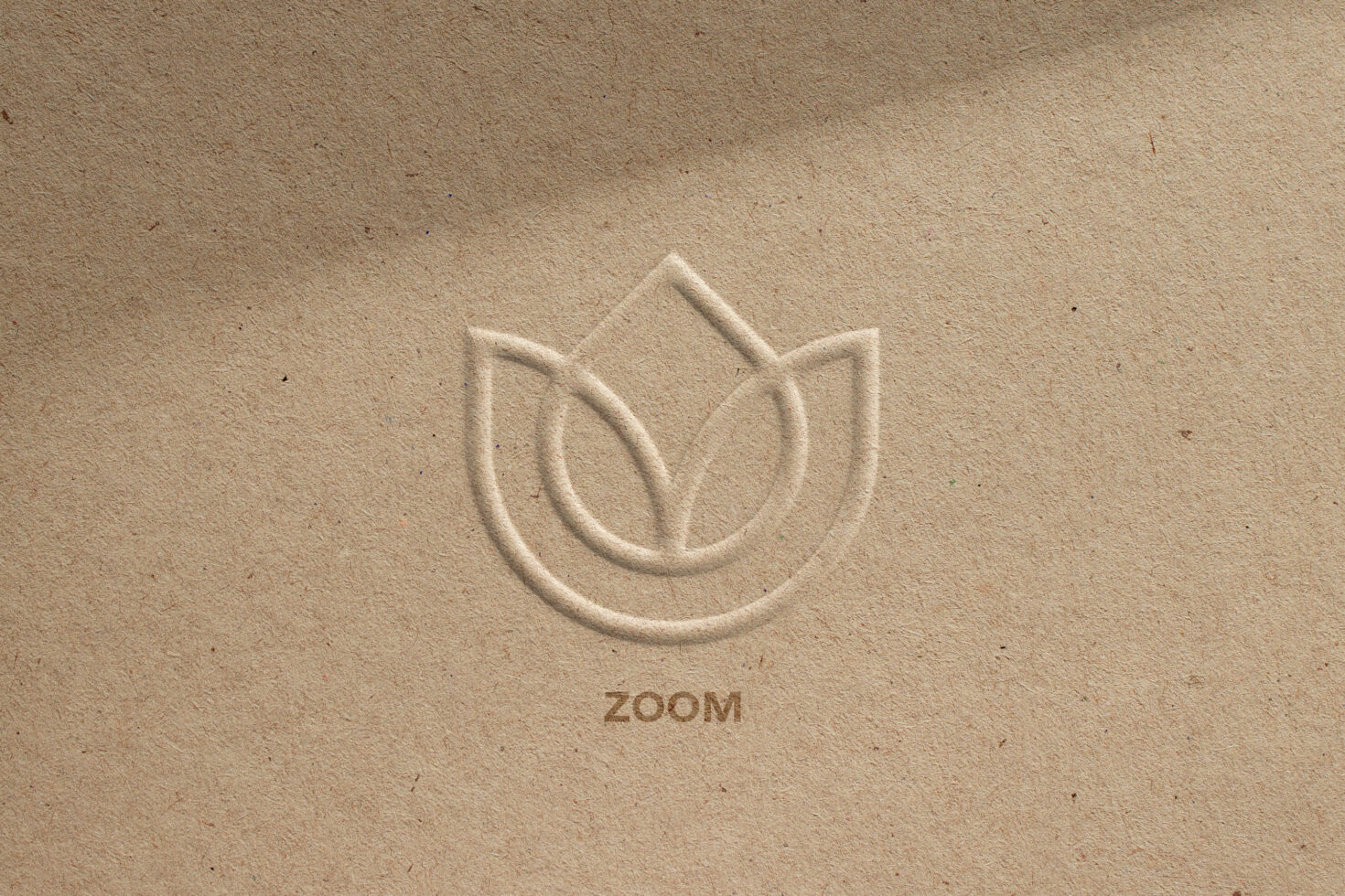 Embossed logo mockup on brown cardboard texture with floral design and zoom text branding presentation digital assets for designers marketplace