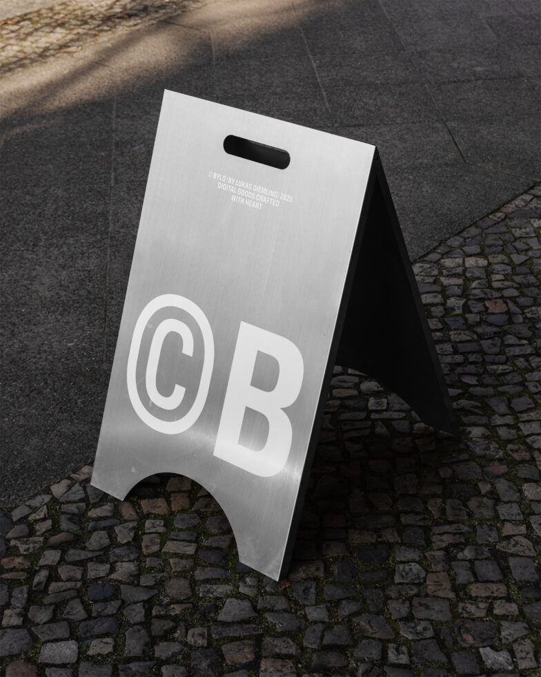 Metallic sidewalk sign mockup on cobblestone street surface great for showcasing branding or logo designs reflective texture urban setting templates