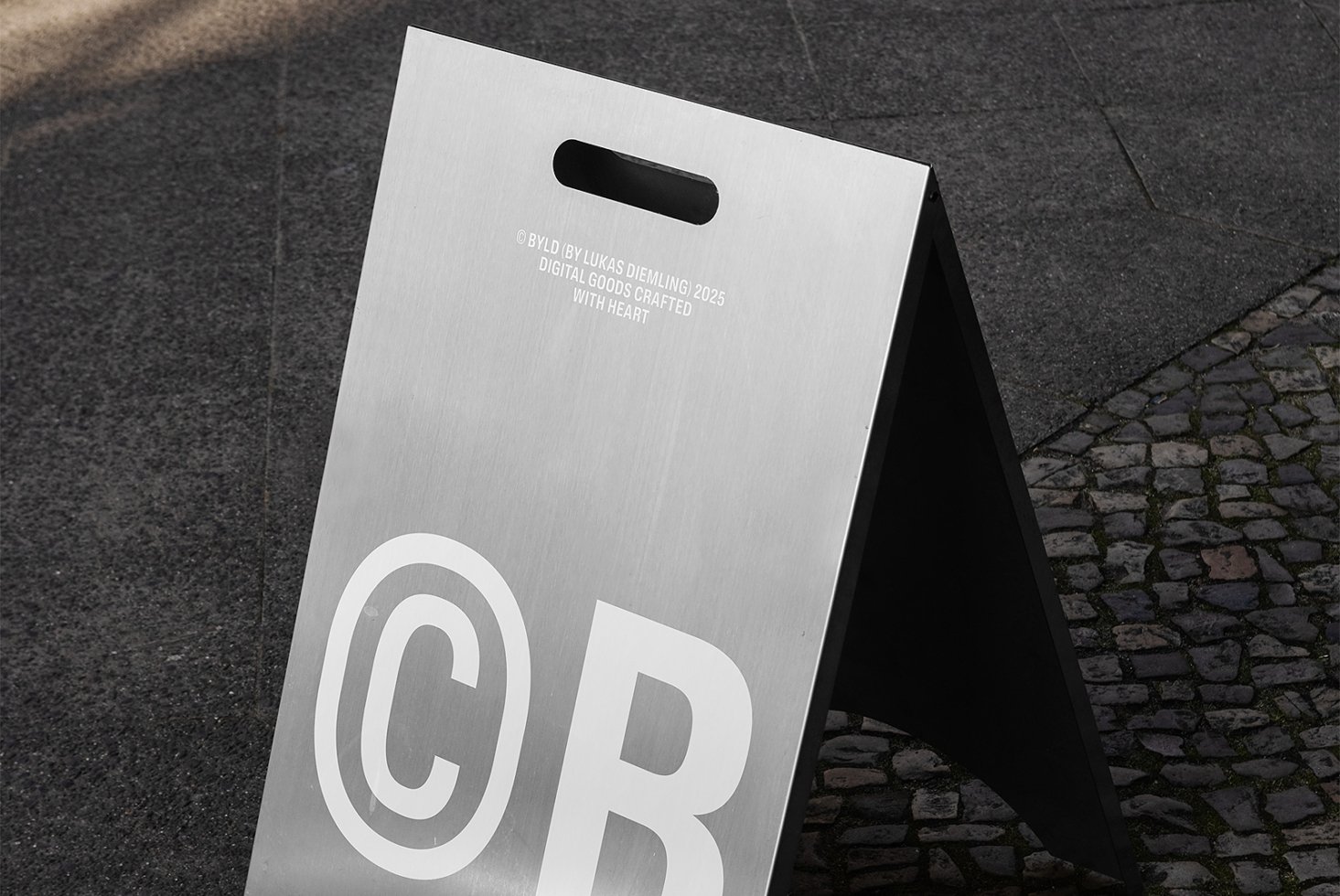 Metal A-frame sign mockup on pavement targeted for designers suits promotion templates branding urban signage digital assets marketing projects.