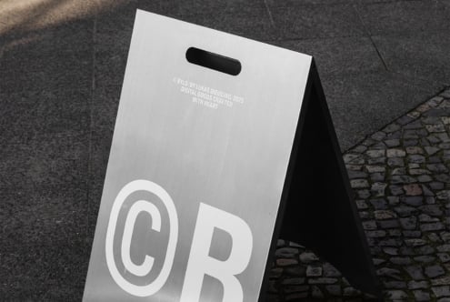 Metal A-frame sign mockup on pavement targeted for designers suits promotion templates branding urban signage digital assets marketing projects.