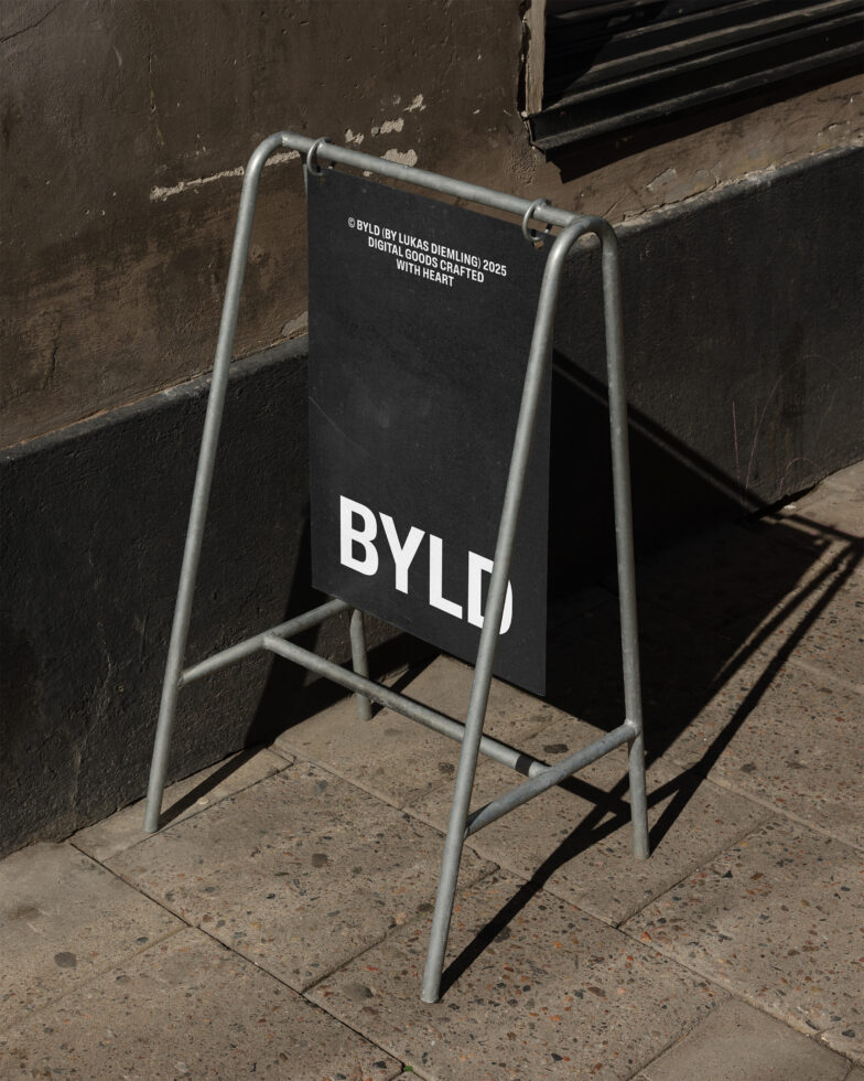 Outdoor pavement sign mockup with black background and white text reading BYLD. Ideal for showcasing design templates or creative branding in urban settings.