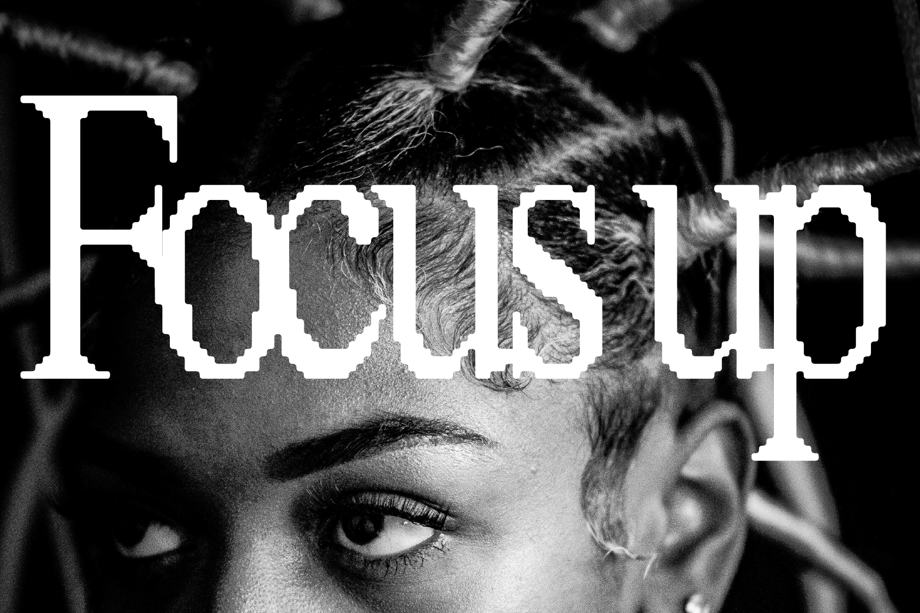 Black and white portrait of a person with braided hair, overlaid with large focus up text in a bold font. Ideal for graphic designers and typography projects.