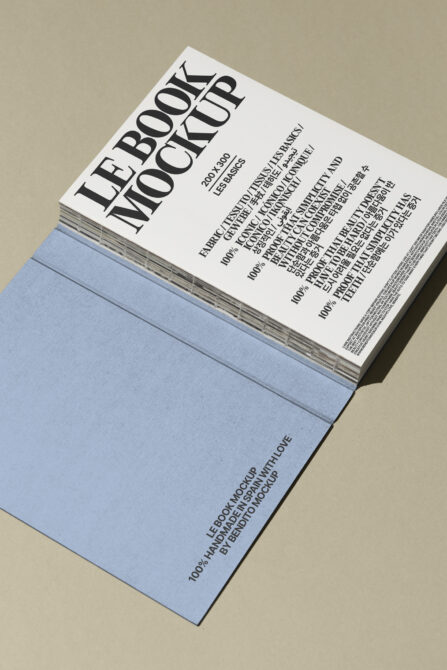 Book mockup with blue cover and detailed typography for graphic designers. Ideal for showcasing book designs in presentations. Mockup resource.