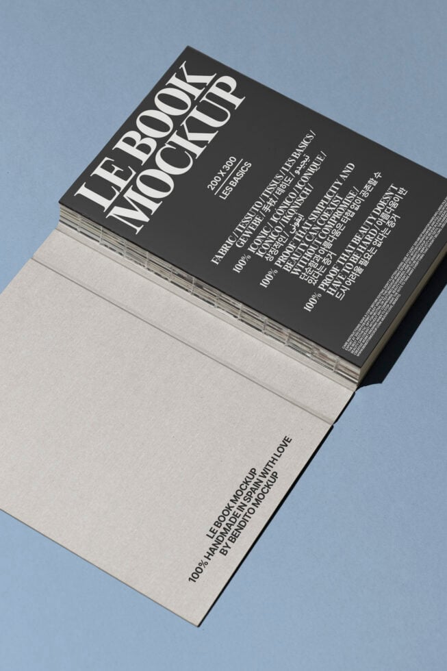 Book mockup in landscape orientation on blue surface featuring cover with bold typography. Ideal for design presentations and showcasing brand identity.