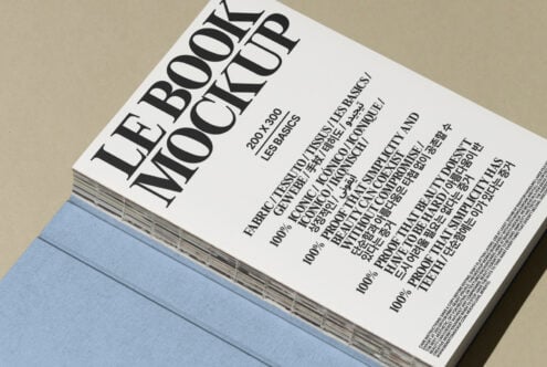 Book mockup with multilingual text on cover, featuring modern typography. Ideal for designers seeking professional print mockup templates for projects.