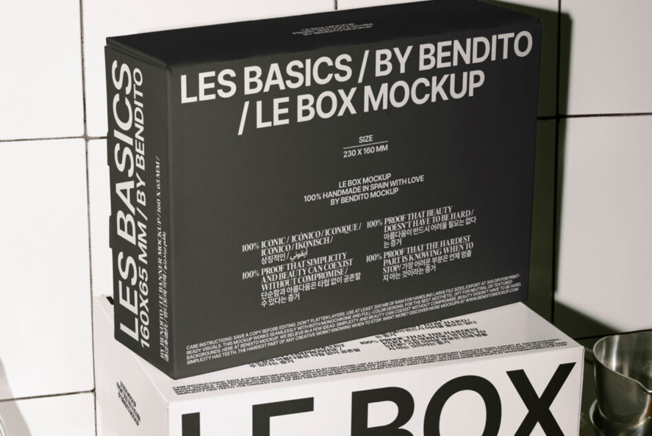 Dark charcoal box mockup shown from angled perspective against white tiles