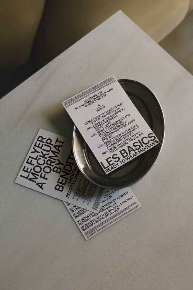 Flyer mockup set on a sleek plate and surface. Fashion-forward design ideal for showcasing unique templates or graphics in stylish branding projects.