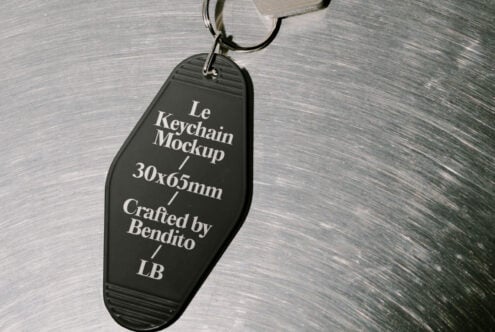 Black keychain mockup on metal surface for designers crafted by Bendito in 30x65mm size ideal for graphic and template projects featuring LB branding.