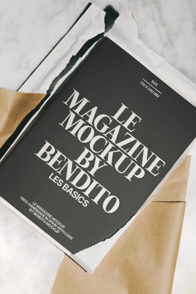 Magazine mockup layout on a marble surface with torn paper aesthetic. Ideal for designers seeking stylish graphics, templates, and branding assets.