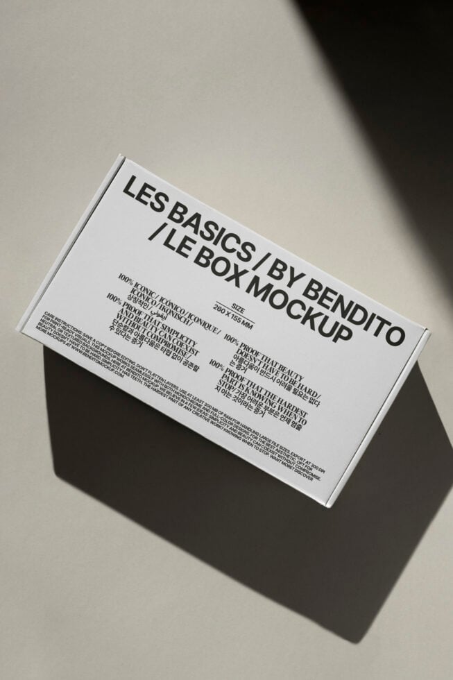 Rectangular box mockup with minimalist typography design on white background. Ideal for packaging design projects. Keywords: box, mockup, design, template.