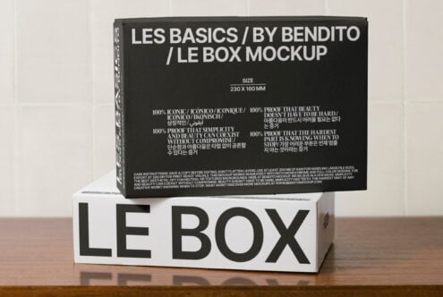 Mockup of minimalist branded boxes for packaging design featuring bold typography on black and white surfaces suitable for graphic design presentations.