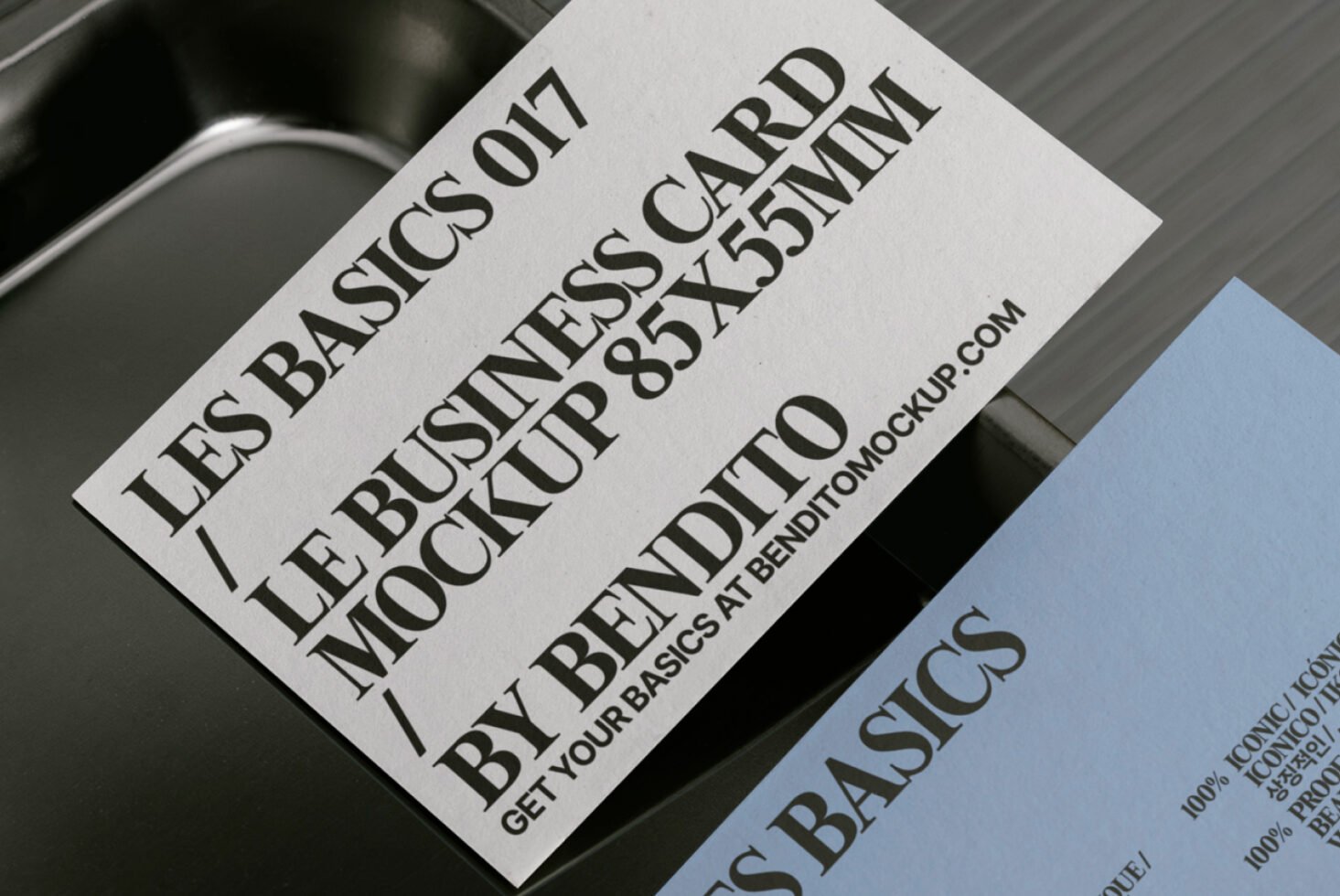 Business card mockup showcasing 85x55mm cards with elegant typography on black and blue backgrounds perfect for designers and branding presentations