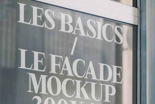 Shop window with minimalist glass signage mockup. Perfect for designers seeking storefront mockups for branding. Styled in clear modern typography.