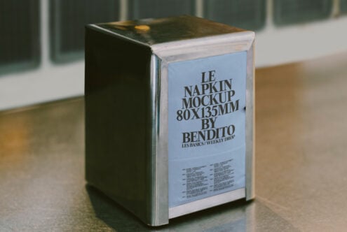 Metal napkin holder mockup displaying Le Napkin Mockup 80x135mm by Bendito. Ideal for designers seeking realistic template graphics for presentations.