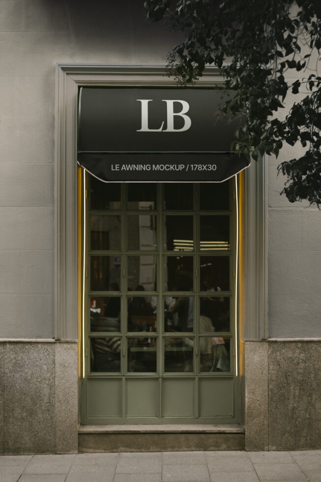 Awning mockup featuring a classic storefront window with dark green frame. Perfect for branding projects, design presentations, and graphic templates.