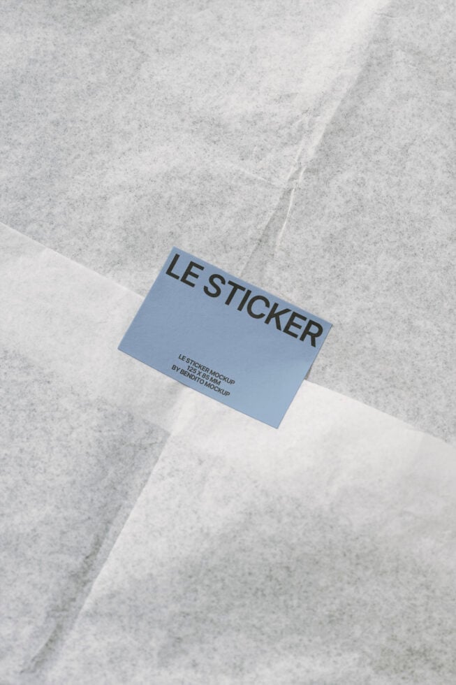 Sticker mockup on textured paper background for designers. Ideal for branding and graphic design. High-quality template for digital project presentations.