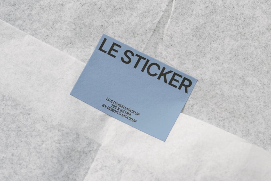 Blue sticker mockup angled on concrete with cross shadow overlay