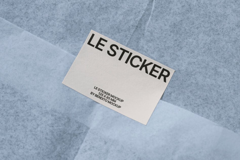 Cream sticker mockup angled on concrete with cross shadow overlay