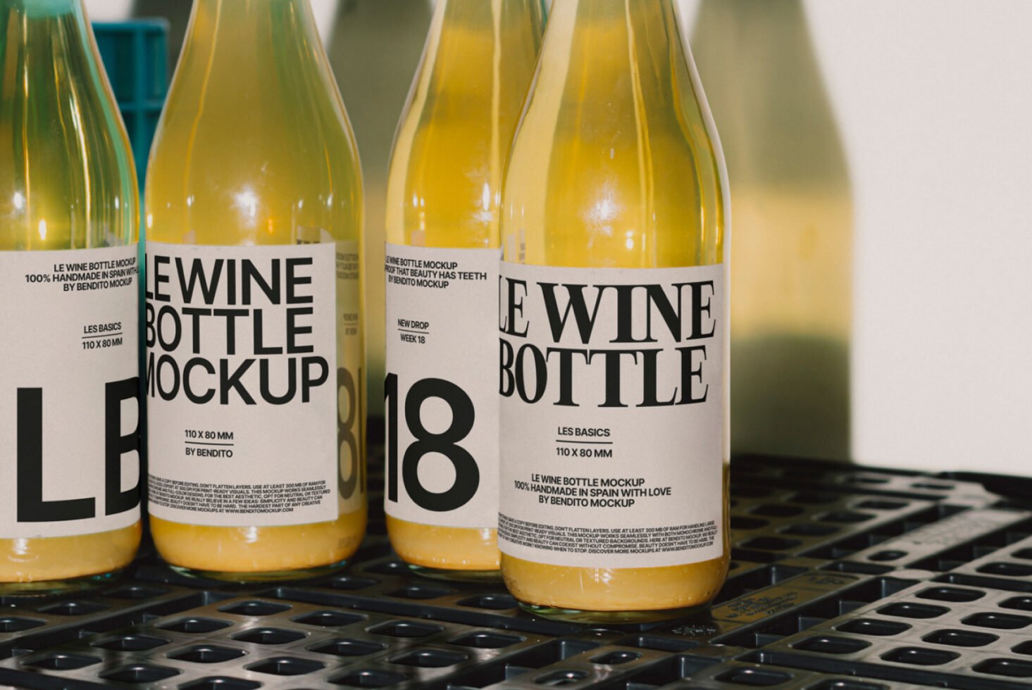 Wine bottle mockup featuring minimalist labels on yellow liquid bottles, perfect for designers seeking realistic product presentation for branding projects.