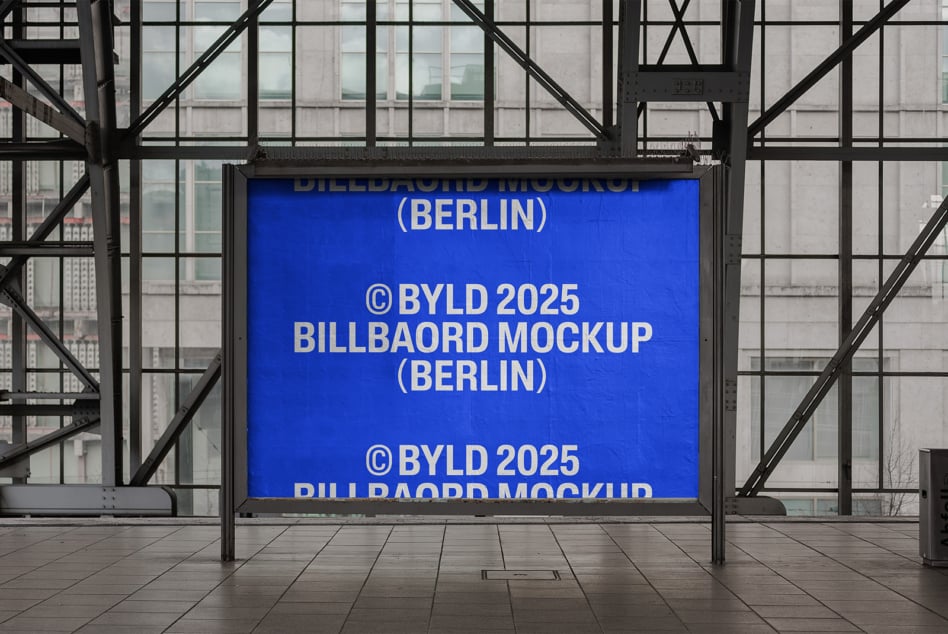 Electric blue lit billboard showing text in glass shelter with city views